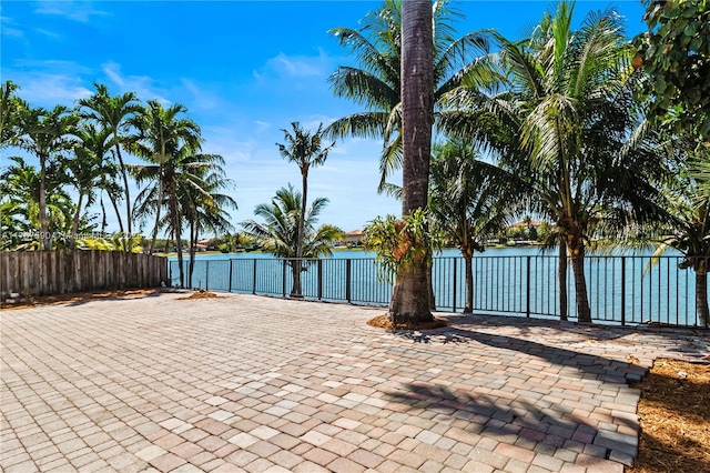 2080 SW 152nd Pl, Miami, FL 33185 - view of patio / terrace with a water view and fence