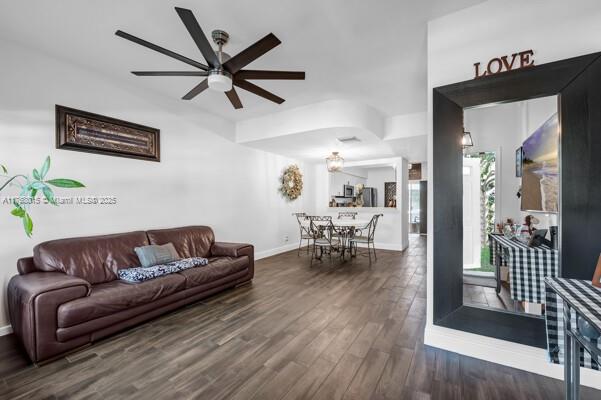 7833 Sanibel Dr Unit 7833, Tamarac, FL 33321 - living area featuring wood finished floors, baseboards, and ceiling fan
