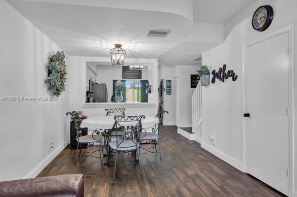7833 Sanibel Dr Unit 7833, Tamarac, FL 33321 - dining space featuring wood finished floors, visible vents, and baseboards