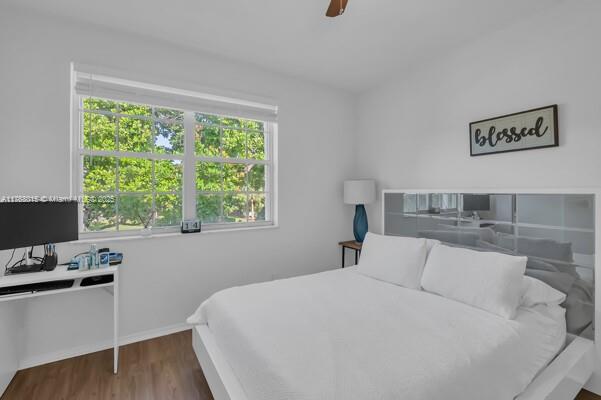 7833 Sanibel Dr Unit 7833, Tamarac, FL 33321 - bedroom featuring wood finished floors and a ceiling fan