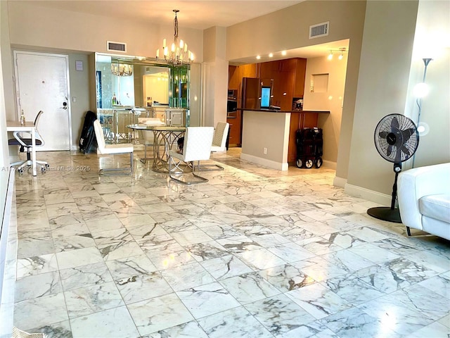 dining room with visible vents, baseboards, and marble finish floor