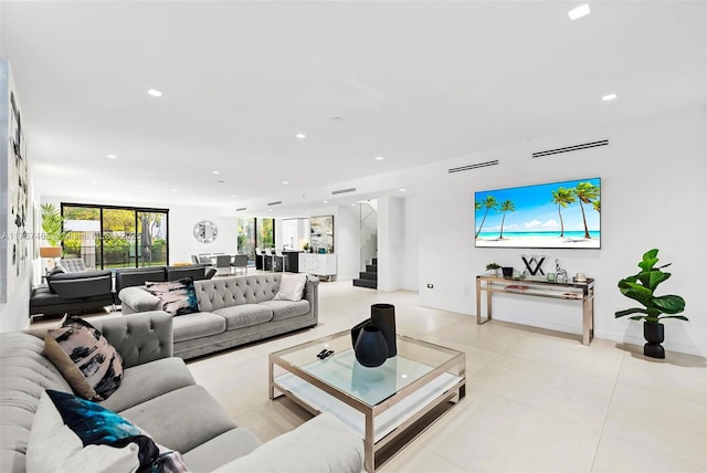 2572 NE 182nd Ter, North Miami Beach, FL 33160 - living area with recessed lighting, stairs, and light tile patterned floors