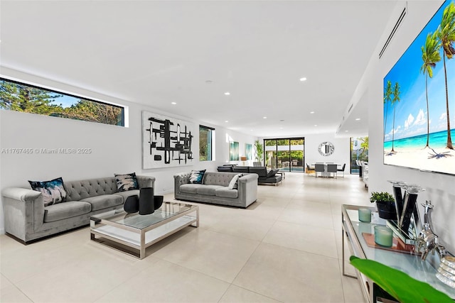 2572 NE 182nd Ter, North Miami Beach, FL 33160 - tiled living room featuring recessed lighting and visible vents