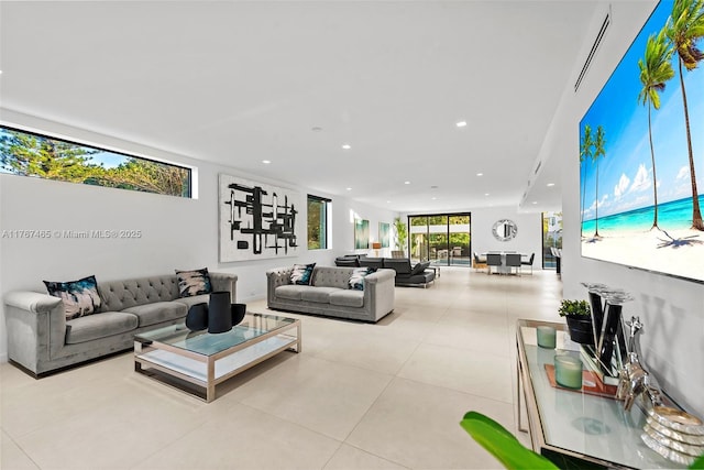 2572 NE 182nd Ter, North Miami Beach, FL 33160 - living room with recessed lighting and tile patterned flooring