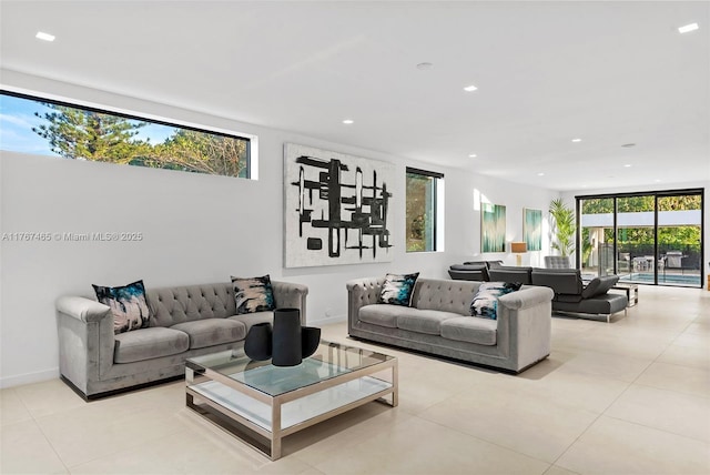 2572 NE 182nd Ter, North Miami Beach, FL 33160 - living area with tile patterned floors, floor to ceiling windows, recessed lighting, and baseboards