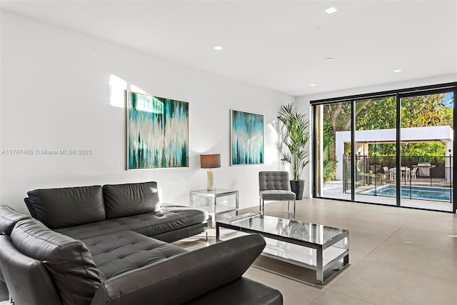 2572 NE 182nd Ter, North Miami Beach, FL 33160 - living area featuring recessed lighting and concrete floors