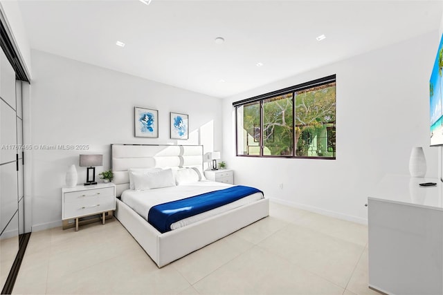 2572 NE 182nd Ter, North Miami Beach, FL 33160 - bedroom with light tile patterned floors and baseboards