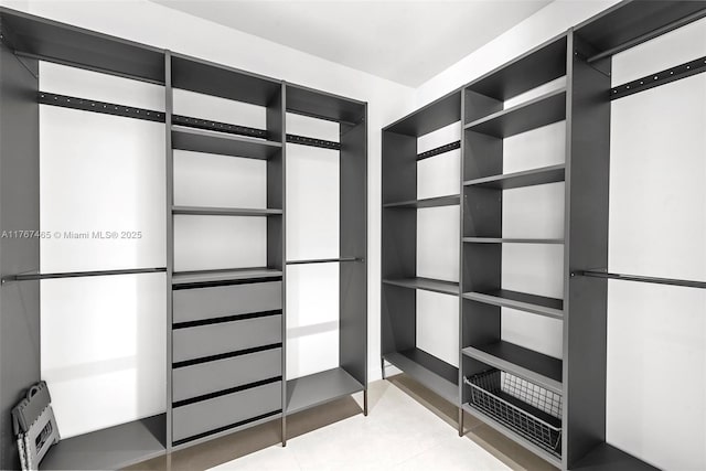 2572 NE 182nd Ter, North Miami Beach, FL 33160 - walk in closet with light tile patterned floors
