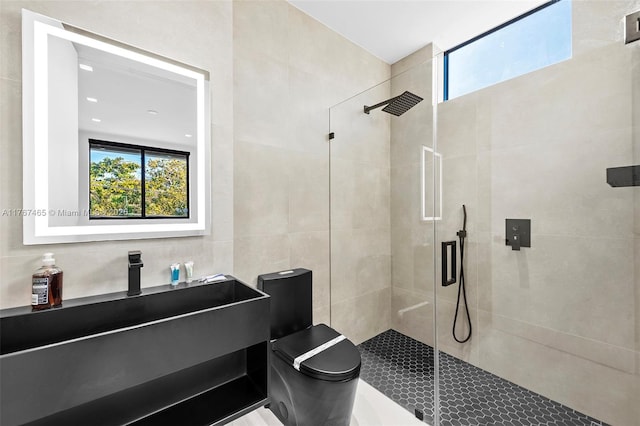 2572 NE 182nd Ter, North Miami Beach, FL 33160 - bathroom featuring tile walls, a stall shower, and a healthy amount of sunlight