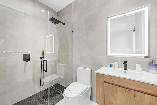 2572 NE 182nd Ter, North Miami Beach, FL 33160 - full bath with vanity, tile walls, toilet, and a stall shower
