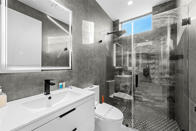 2572 NE 182nd Ter, North Miami Beach, FL 33160 - full bathroom with toilet, a stall shower, tile walls, and vanity