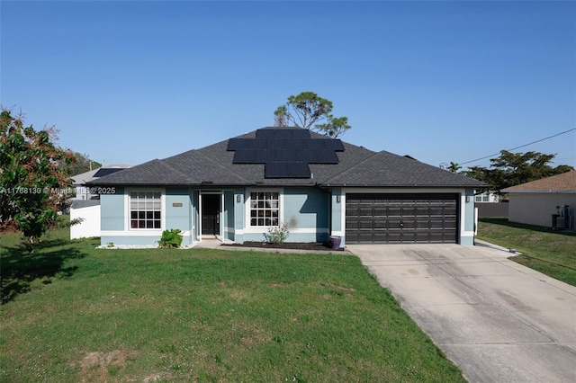 3705 NE 15th Ave, Cape Coral, FL 33909 - single story home with solar panels, an attached garage, a front yard, roof with shingles, and driveway