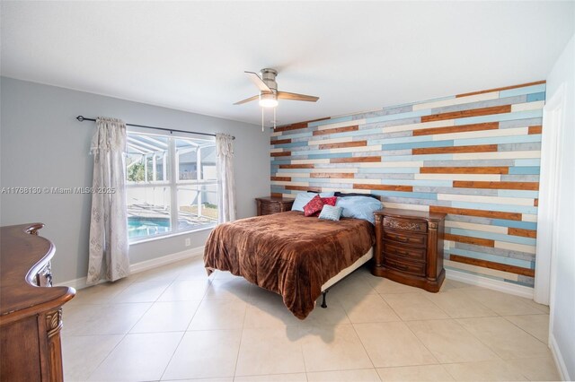3705 NE 15th Ave, Cape Coral, FL 33909 - tiled bedroom featuring baseboards, ceiling fan, and an accent wall