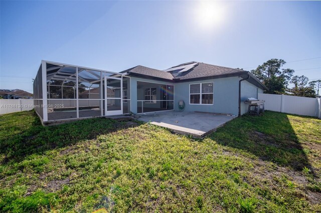 3705 NE 15th Ave, Cape Coral, FL 33909 - back of house featuring a yard, a fenced backyard, and a patio area