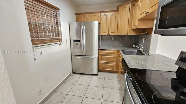 13715 Kendale Lakes Cir Unit A-201, Miami, FL 33183 - kitchen with stainless steel appliances, a sink, decorative backsplash, light tile patterned floors, and baseboards