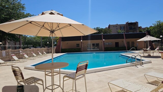 13715 Kendale Lakes Cir Unit A-201, Miami, FL 33183 - community pool with a patio