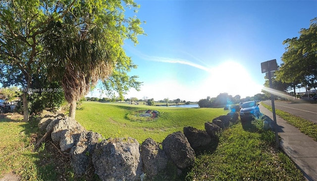 13715 Kendale Lakes Cir Unit A-201, Miami, FL 33183 - view of grassy yard featuring a water view
