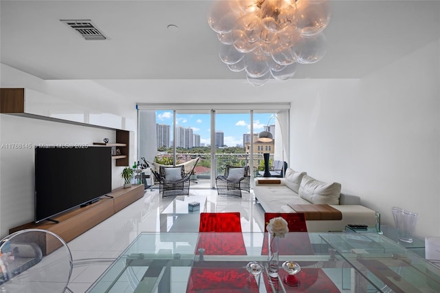 living area featuring a notable chandelier and visible vents