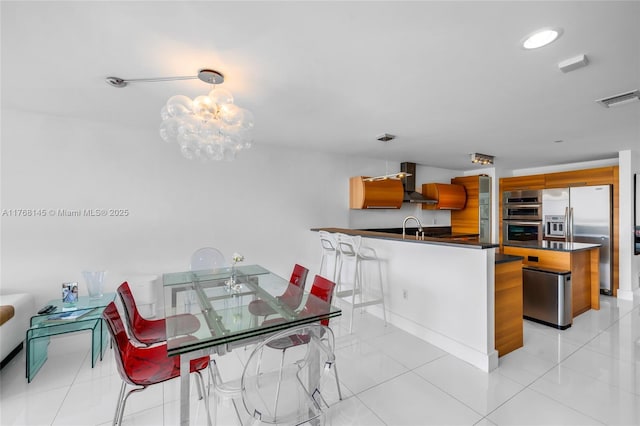 dining space featuring a notable chandelier, visible vents, and light tile patterned floors