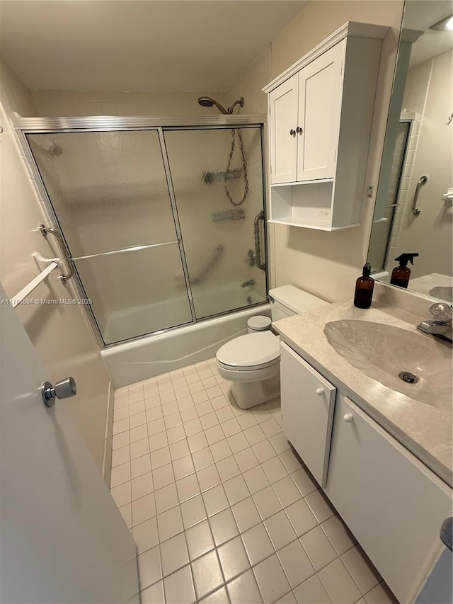 804 Cypress Blvd Unit 407, Pompano Beach, FL 33069 - bathroom featuring tile patterned flooring, vanity, and enclosed tub / shower combo