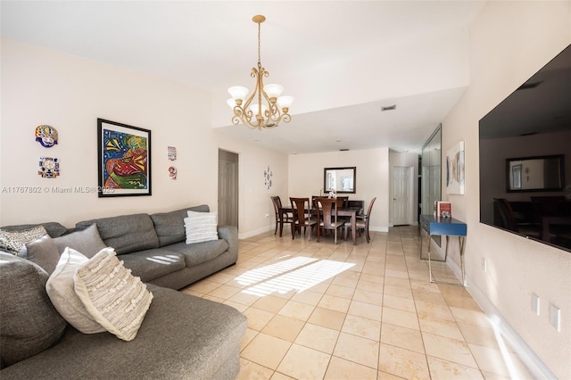 living room with light tile patterned floors, visible vents, baseboards, and an inviting chandelier