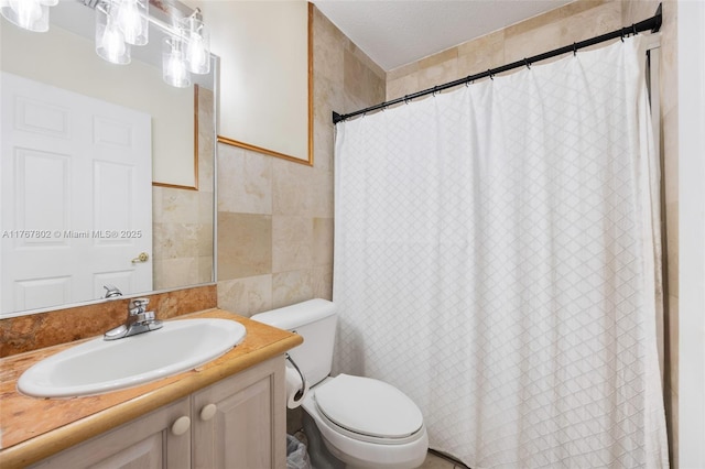 bathroom featuring vanity, tile walls, curtained shower, and toilet