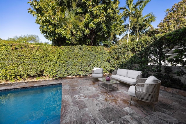 view of patio featuring an outdoor living space, a fenced in pool, and a fenced backyard