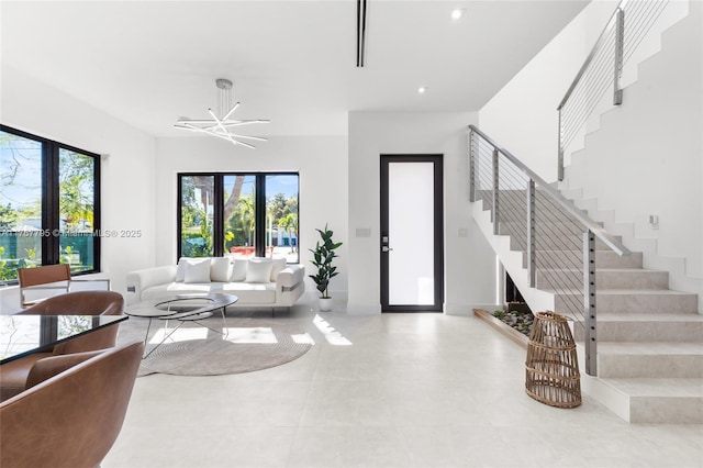2523 Red Rd, Coral Gables, FL 33134 - tiled living room with stairway, a chandelier, and recessed lighting