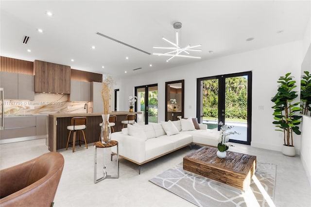 2523 Red Rd, Coral Gables, FL 33134 - living area featuring recessed lighting, french doors, and concrete floors