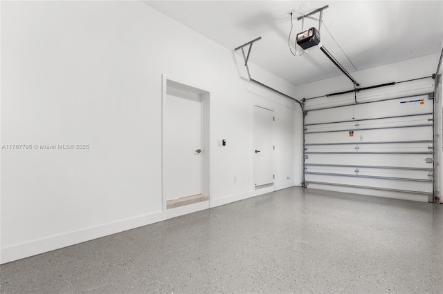 2523 Red Rd, Coral Gables, FL 33134 - garage featuring a garage door opener and baseboards