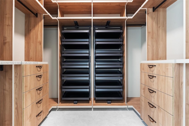 2523 Red Rd, Coral Gables, FL 33134 - walk in closet featuring light tile patterned floors