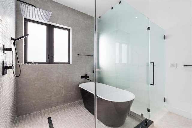 2523 Red Rd, Coral Gables, FL 33134 - full bathroom with a shower stall, a freestanding tub, and tile patterned flooring