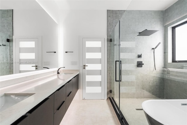 2523 Red Rd, Coral Gables, FL 33134 - full bath with a shower stall, double vanity, a freestanding tub, and tile patterned flooring