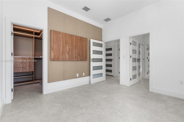 2523 Red Rd, Coral Gables, FL 33134 - unfurnished bedroom with a walk in closet and a closet