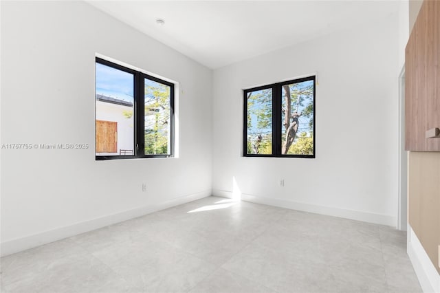 2523 Red Rd, Coral Gables, FL 33134 - spare room featuring plenty of natural light and baseboards