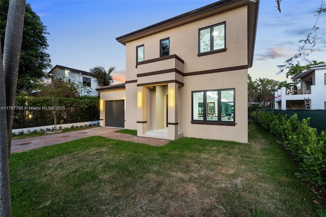 2523 Red Rd, Coral Gables, FL 33134 - rear view of property with stucco siding, driveway, and a garage
