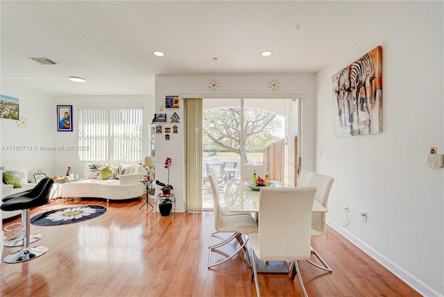 7807 NW 114th Pl, Doral, FL 33178 - dining space featuring light wood finished floors, visible vents, a healthy amount of sunlight, and baseboards