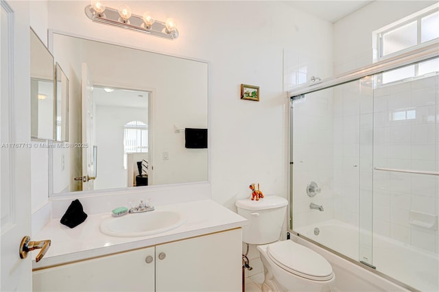 7807 NW 114th Pl, Doral, FL 33178 - full bath featuring vanity, toilet, and bath / shower combo with glass door