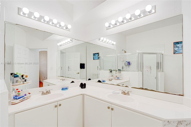 7807 NW 114th Pl, Doral, FL 33178 - bathroom featuring double vanity, a shower stall, and a sink