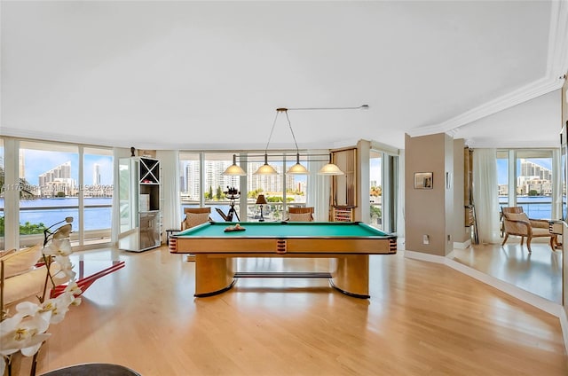 game room featuring a wall of windows, baseboards, light wood-style flooring, and pool table