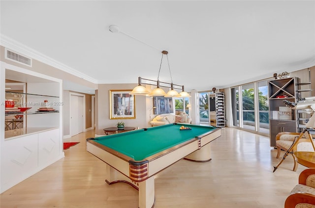 game room featuring visible vents, pool table, crown molding, expansive windows, and wood finished floors