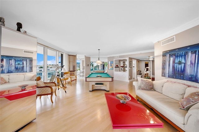 living room with light wood finished floors, visible vents, pool table, and ornamental molding