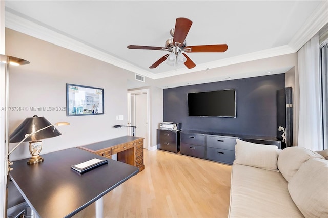 home office featuring visible vents, crown molding, a ceiling fan, and light wood finished floors