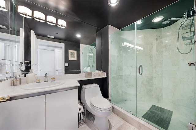 bathroom featuring toilet, a stall shower, recessed lighting, tile patterned flooring, and vanity