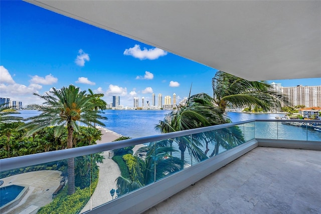 balcony with a view of city and a water view