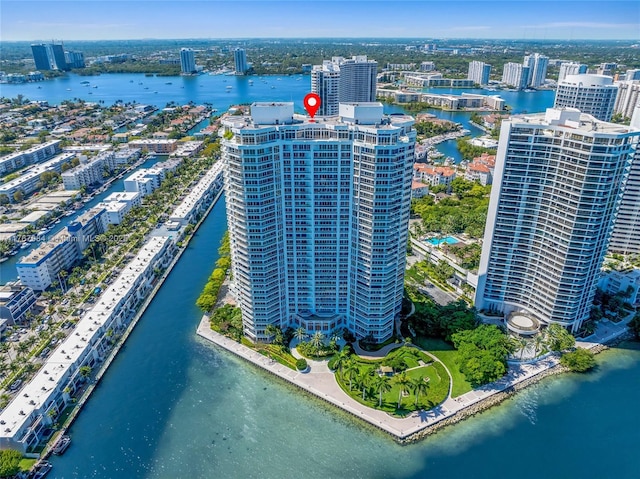 birds eye view of property featuring a view of city and a water view