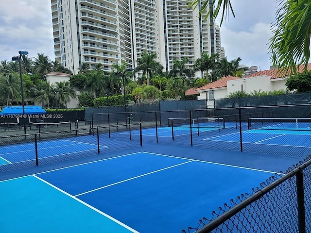 view of sport court with fence