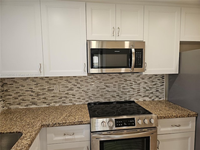 250 Layne Blvd Unit 105, Hallandale Beach, FL 33009 - kitchen featuring light stone countertops, appliances with stainless steel finishes, white cabinets, decorative backsplash, and recessed lighting
