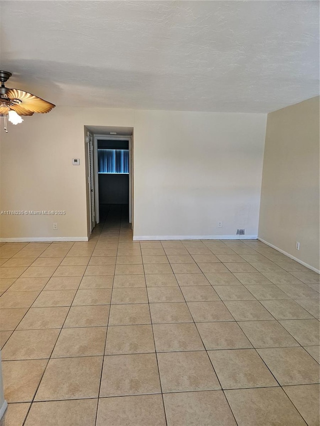 250 Layne Blvd Unit 105, Hallandale Beach, FL 33009 - unfurnished room with light tile patterned floors, baseboards, and ceiling fan