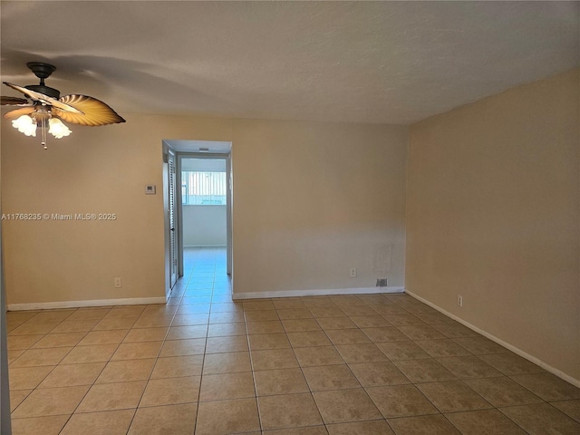 250 Layne Blvd Unit 105, Hallandale Beach, FL 33009 - unfurnished room with a ceiling fan, light tile patterned floors, baseboards, and a textured ceiling